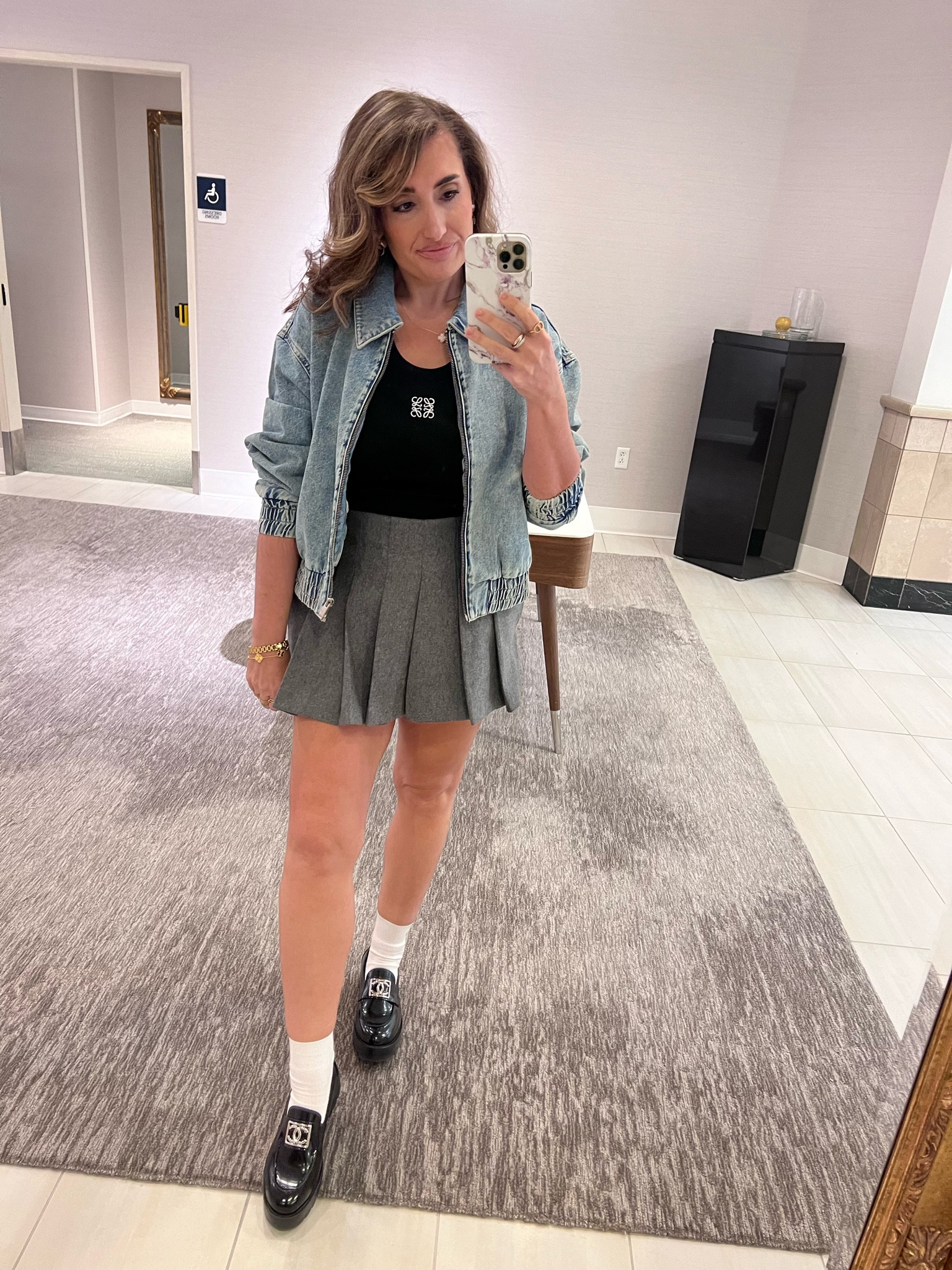 European style, skort, Celine socks, Chanel loafers, bomber jackets, Loewe tank 