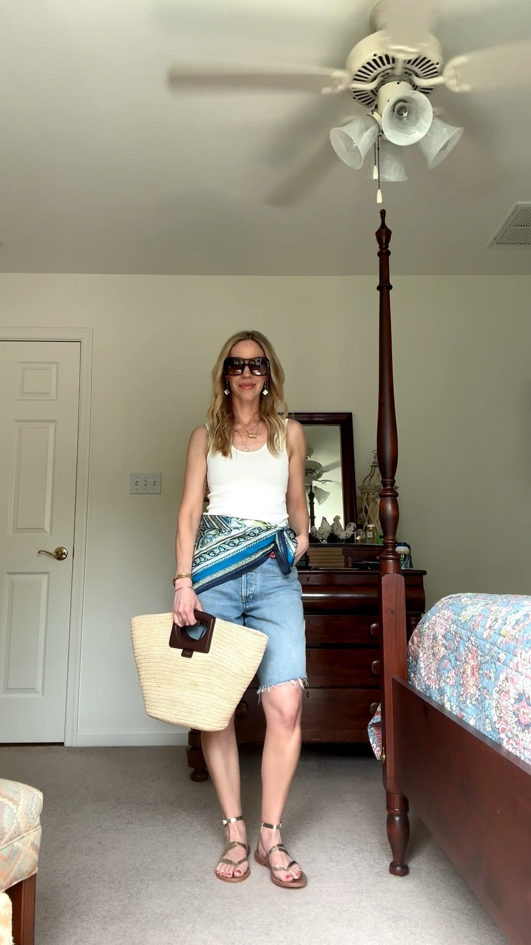 Summer vacation outfit, beach vacation, white tank with denim bermuda shorts, silk scarf tied at waist, straw tote bag

#LTKTravel #LTKOver40 #LTKSeasonal