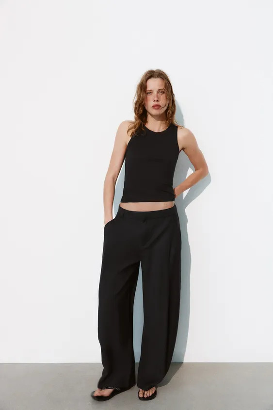 DescriptionCompositionMeasurementsTrousers made from a flowing fabric. High-waist with belt loops... | Zara UK