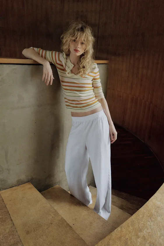 Round neck jumper with sleeves below the elbow and front buttons. | Zara UK