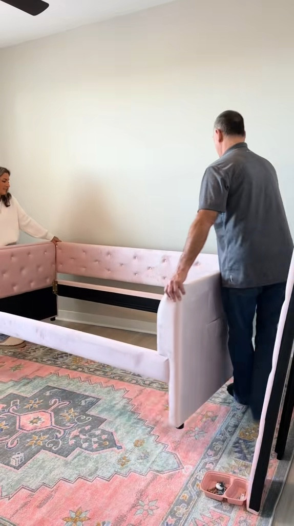 putting together my new pink daybed from Wayfair in my new apartment! this fits a twin mattress up top and has another twin mattress on the bottom that rolls out 💗🏡

#LTKHome