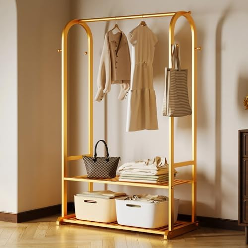 Gold clothing rack with bottom Storage shelves and 6 side hooks,Sturdy metal clothes rack for Han... | Amazon (US)