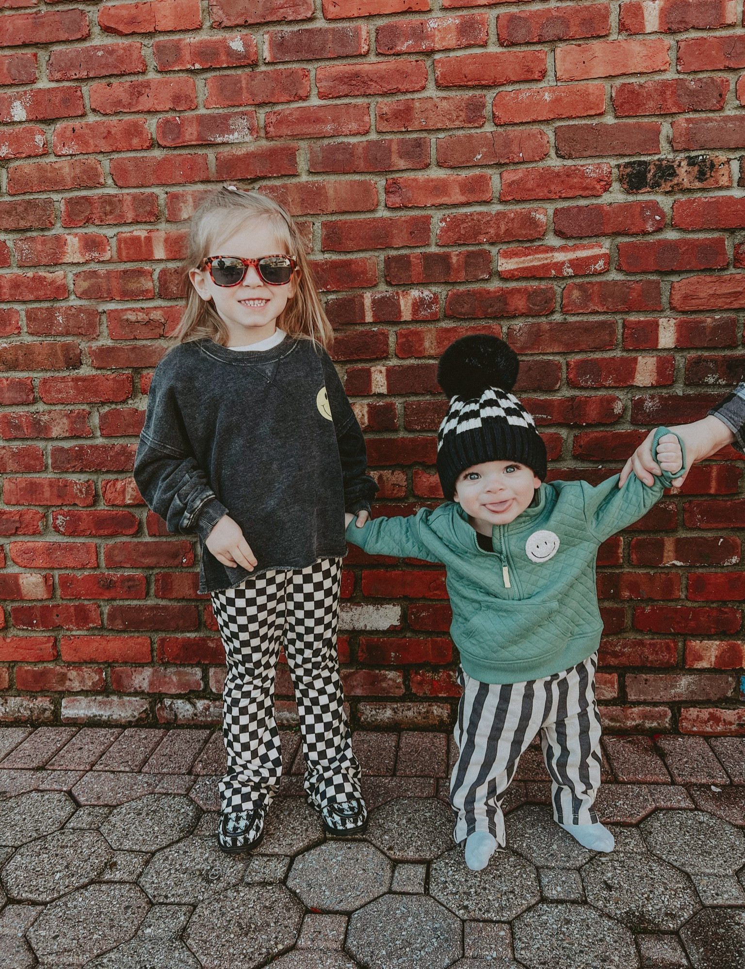 Fall/winter style for toddler girl and baby boy! Checkered pom Pom beanie hat, checkered leggings, smiley face shirt, so cute 🥲

#LTKbaby #LTKkids 

#LTKSeasonal