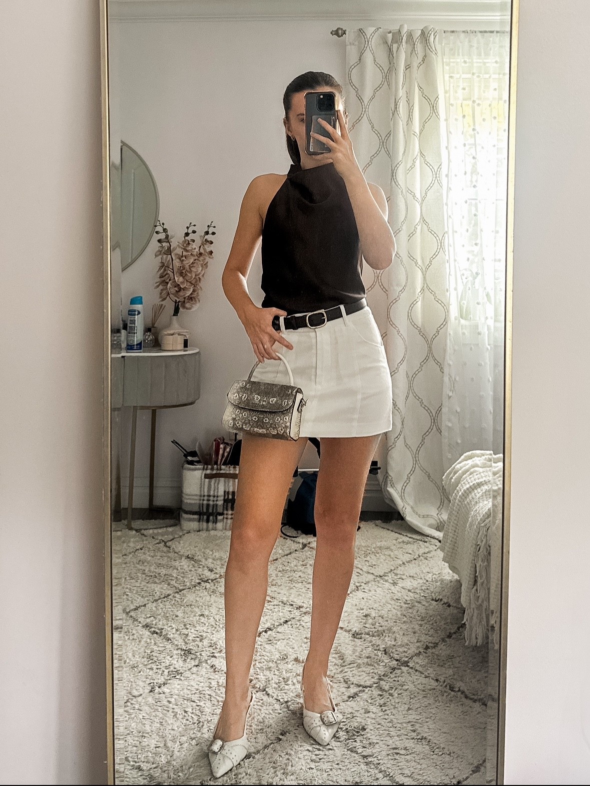 ✨ Chic night out style 🤎🤍 This look features a brown satin halter top paired with a white mini skirt, sleek kitten heels, and a snakeskin top-handle bag. Perfect for a date night outfit, dinner with friends, rooftop drinks, or a summer-to-fall transition look.
.
.
.
.
.
.


Fall outfits | fall shoes | fall tops | date night tops | going out outfits | going out tops | satin top | cute tops | skirt outfits | skirt and top | white skirt outfit | mini skirt outfit | classy heels | white heels | comfy heels | sling back heels | fall bags | outfit ideas | outfit inspo 

#LTKSeasonal #LTKU #LTKSaleAlert #LTKParties #LTKFindsUnder50 #LTKFindsUnder100 #LTKStyleTip #LTKTravel #LTKShoeCrush #LTKItBag