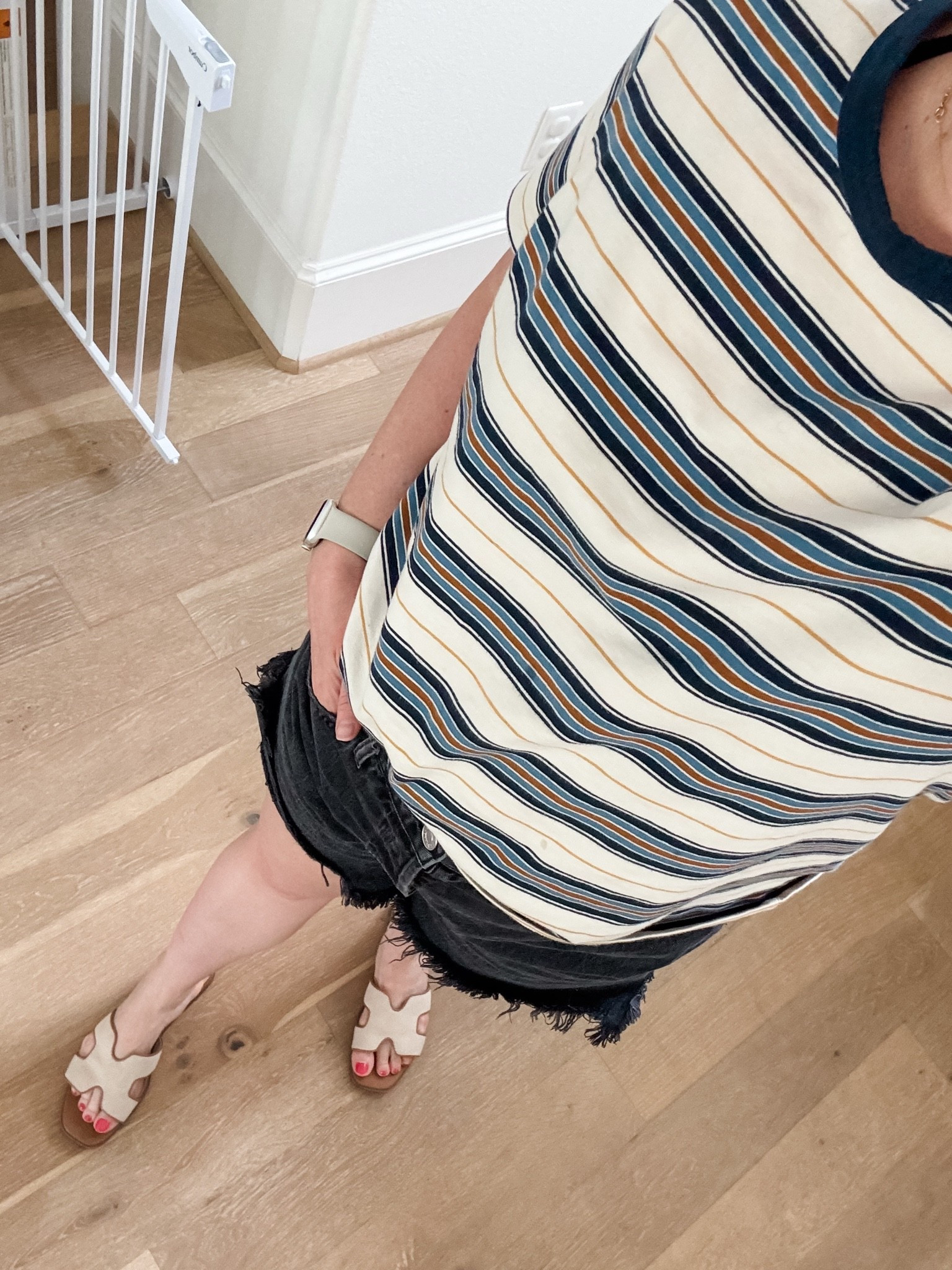 Proof that comfortable and put together can absolutely go together. This is the kind of easy outfit formula I reach for when I want to look polished without sacrificing comfort.
A striped tee and black denim shirts with sandals. 
Comfortable outfits, casual chic style, everyday mom fashion and elevated basics.