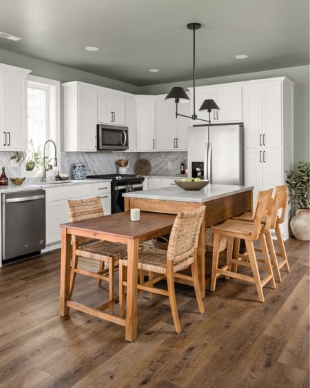 A big island makes for a great kitchen gathering place, and we love that this one extends for extra seating .

#LTKhome