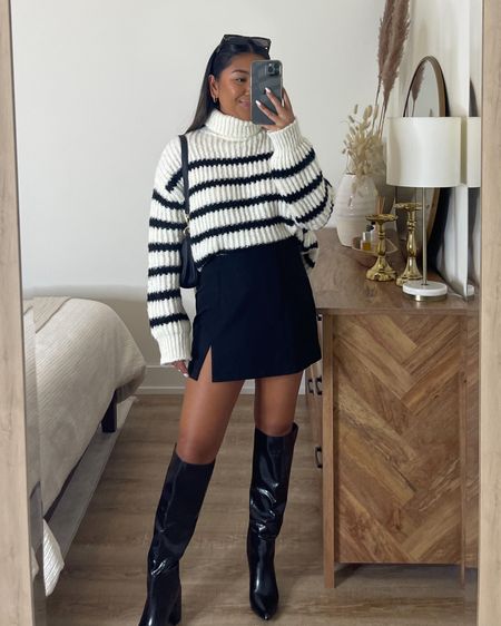 Everyone needs a black and white stripe sweater this fall😍 #fallsweaters #fallfashion #lulus #falloutfit #outfitideas #strippedsweater #miniskirt #blackboots #highkneeboots 