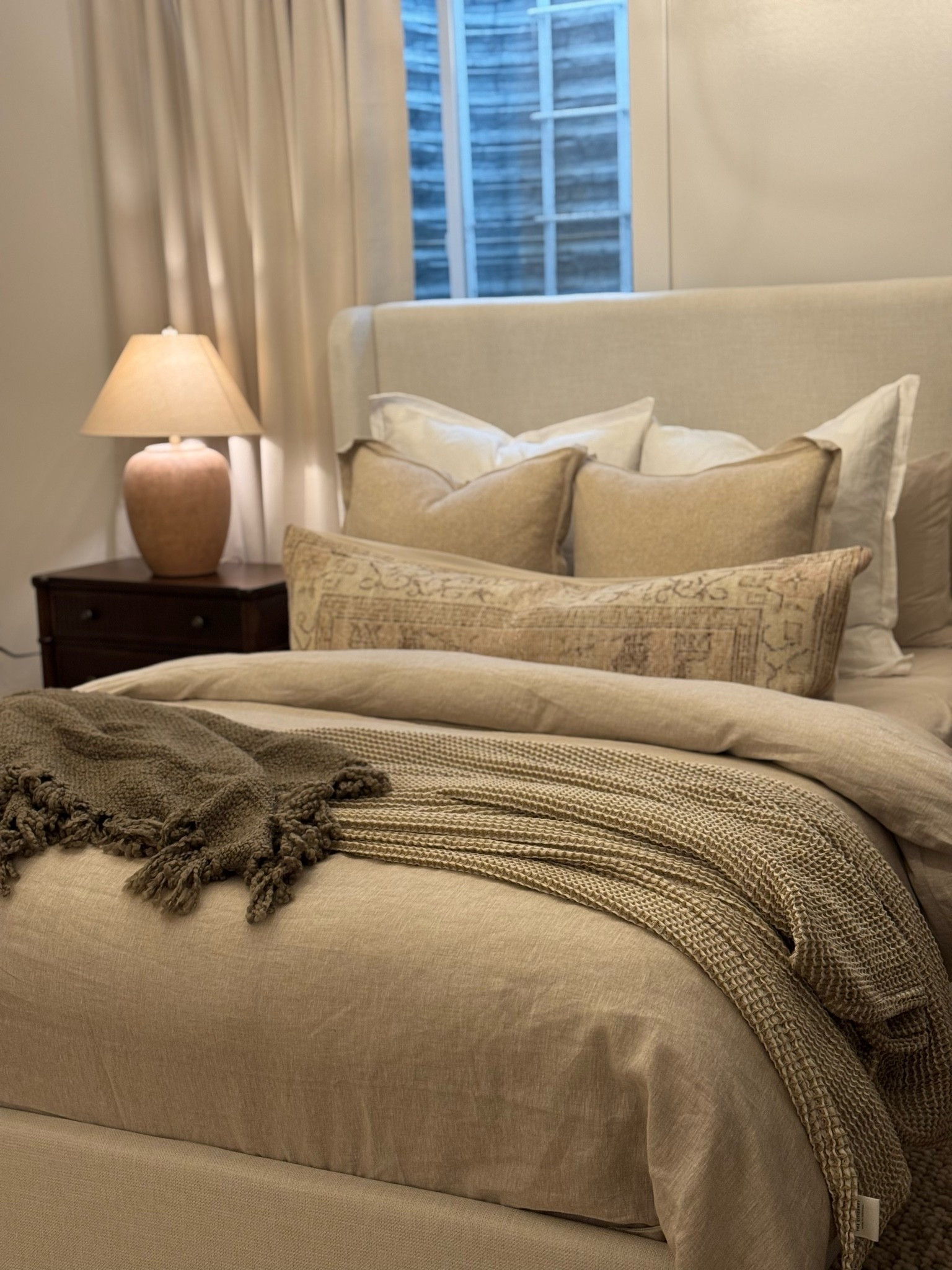 I'm so excited to share the details of this guest room with you!

I shopped mostly Wayfair sales and Facebook Marketplace. Honestly, Facebook Marketplace was the MVP of this makeover. 🙌

The chair and pillows were both Marketplace finds, and I still can't believe I scored them. The pillows are originally from Pottery Barn, but unfortunately they're no longer in stock—which is such a bummer because they're one of my favorite details in the room!

I've linked as much as I could in my profile for anyone looking for similar pieces.

My goal with this room was to create a space that felt warm, welcoming, and like a true retreat for anyone who stays here. It's become one of my favorite spaces in our home, and my heart smiles every time I walk into it. 🤍