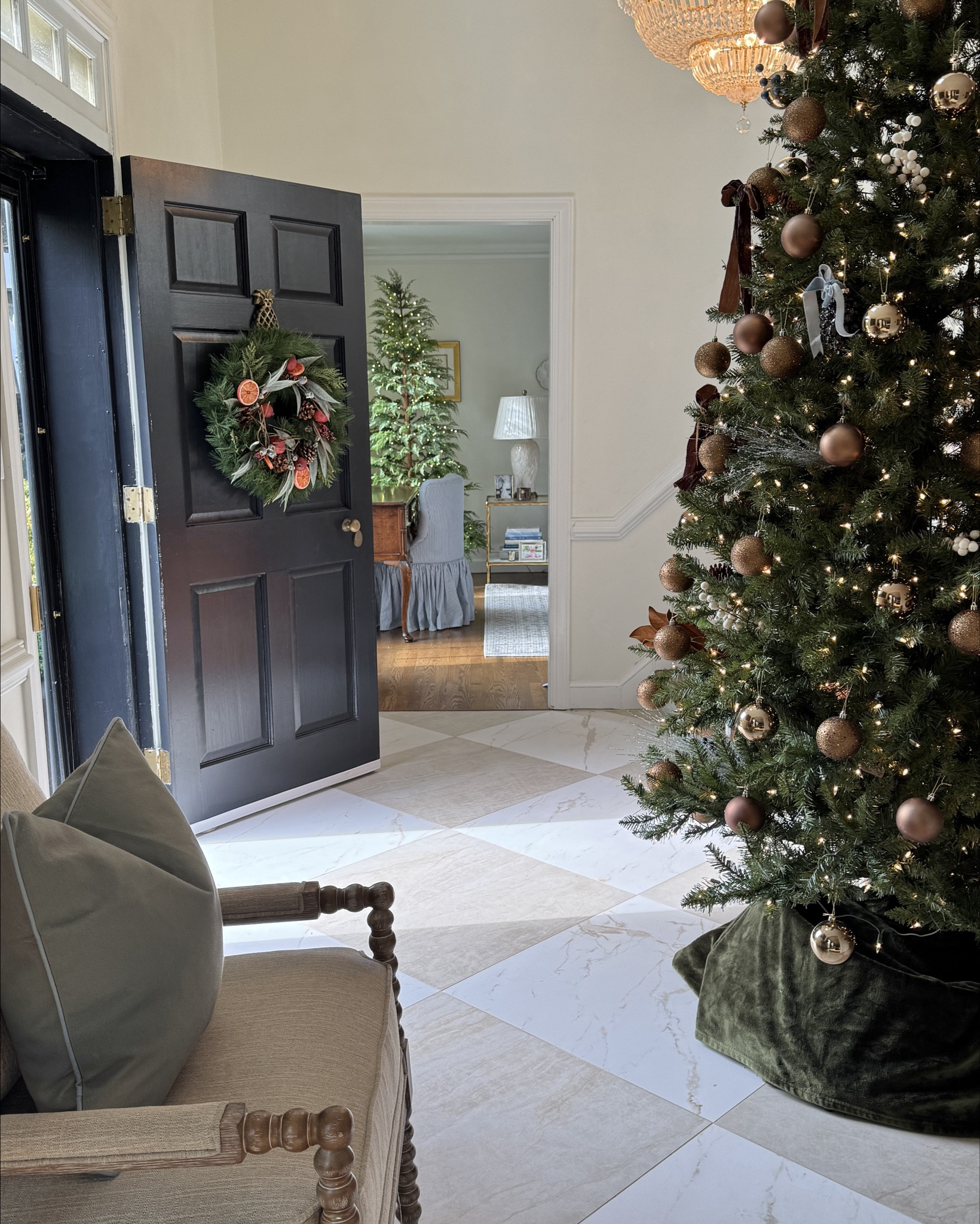 ✨ My foyer tree is always my favorite to put up. This year’s theme was inspired by the magnolia leaf — deep green paired with a rich chocolate brown. 🤎 I found the most beautiful brown ornaments on Wayfair (packaged so well!) and added chocolate velvet bows and a few magnolia leaves for texture.
Beside the tree, I created a small holiday vignette with a fresh rosemary plant, a classic glass hurricane, and an evergreen diffuser that makes the whole downstairs smell like Christmas morning. It even makes my faux tree feel real when guests arrive. 🌲
Linking everything from Wayfair that I used to pull this together! #ad @wayfair #wayfairpartner #Wayfair   #LTKholiday #LTKhome 

#LTKHome #LTKHoliday #LTKSeasonal