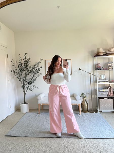 Causal but cute. These light pink cargo pants come in a few colors and are a super soft material! I love that they are wide leg. I sized up to a large for.more room in  hips! 

Top is a little shrug set, wearing a medium.

#LTKSeasonal #LTKmidsize #LTKfindsunder100