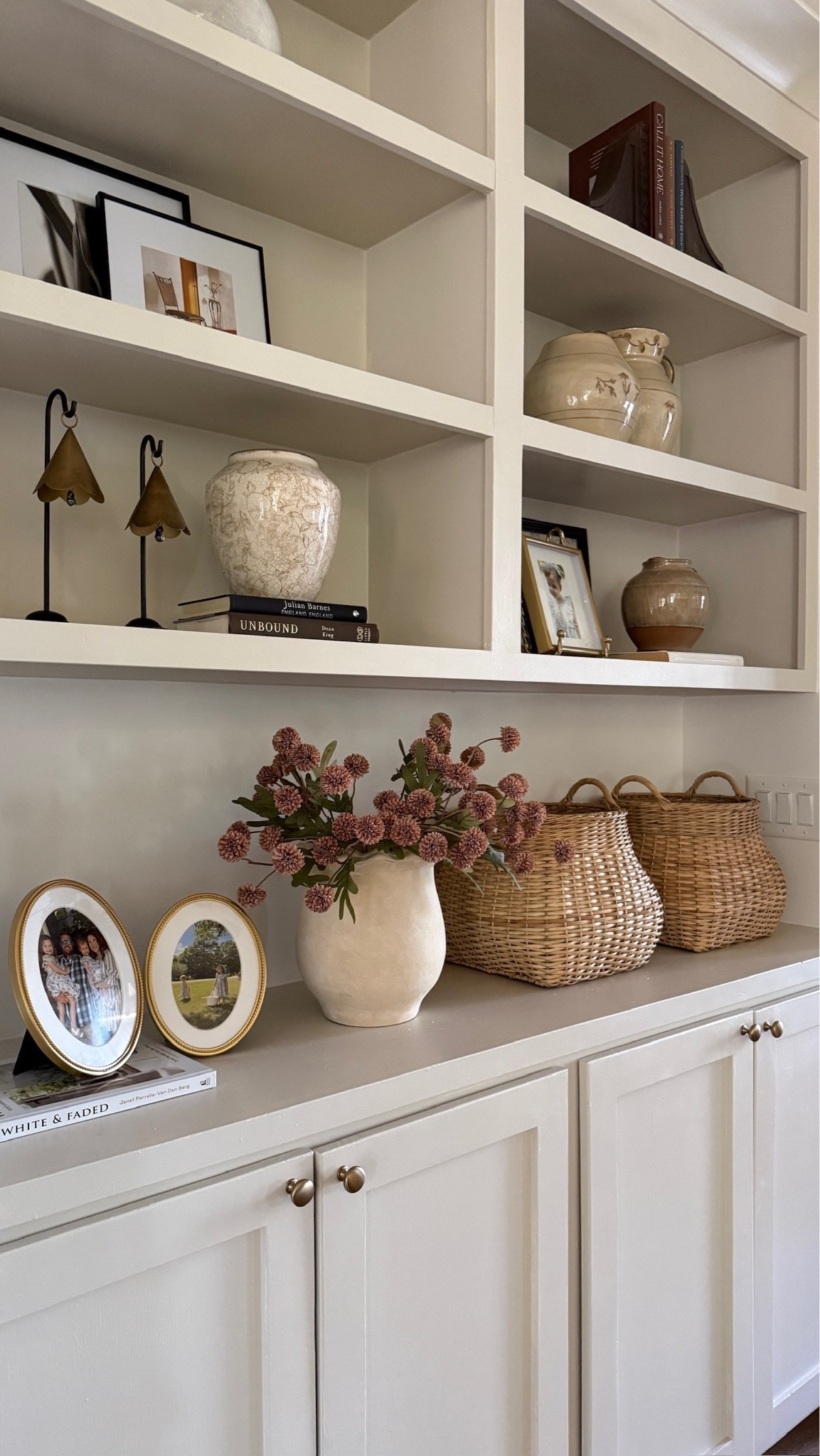 Shelves styled to perfection 🫶🏻 Blending woven details, beautiful ceramics and personal touches created a timeless and welcoming view!

#LTKHome #LTKSeasonal
