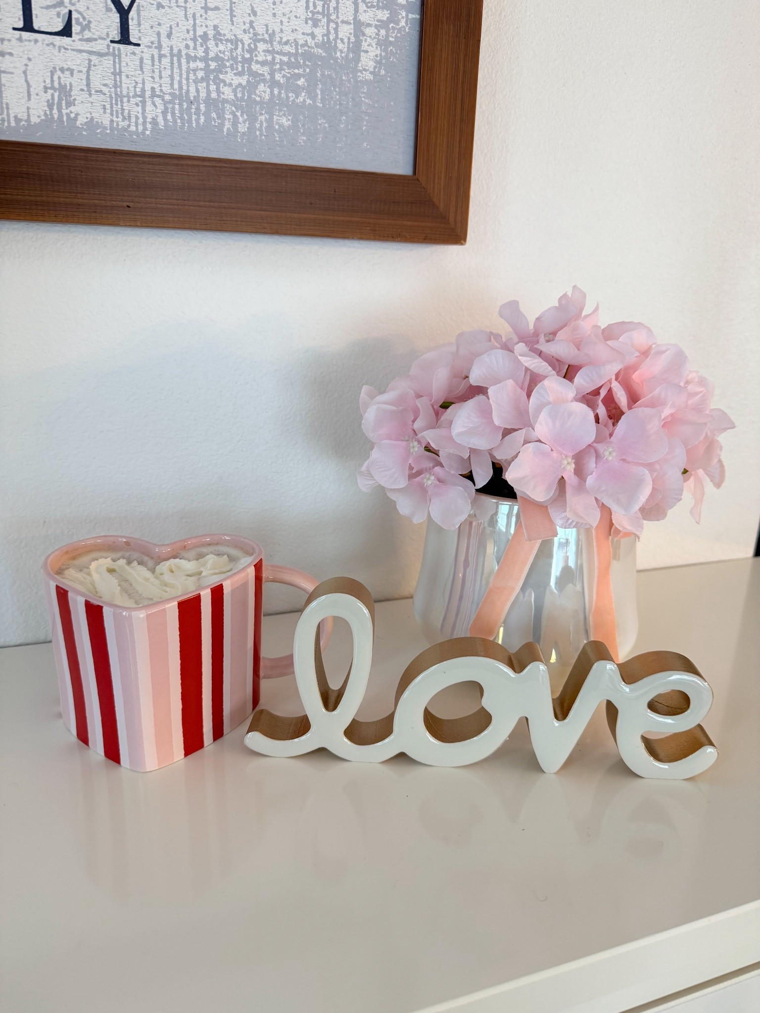 Pink home decor finds I’m loving 🤍
Ceramic pink vase from Walmart, white “love” tabletop sign from Walmart, and the cutest heart mug from Target for $5. 

Easy Valentine’s Day decor, affordable home accents, coffee mug decor, shelf styling ideas, target style, neutral pink decor for any space. Linked here 💕

#LTKGiftGuide #LTKHome #LTKSeasonal
