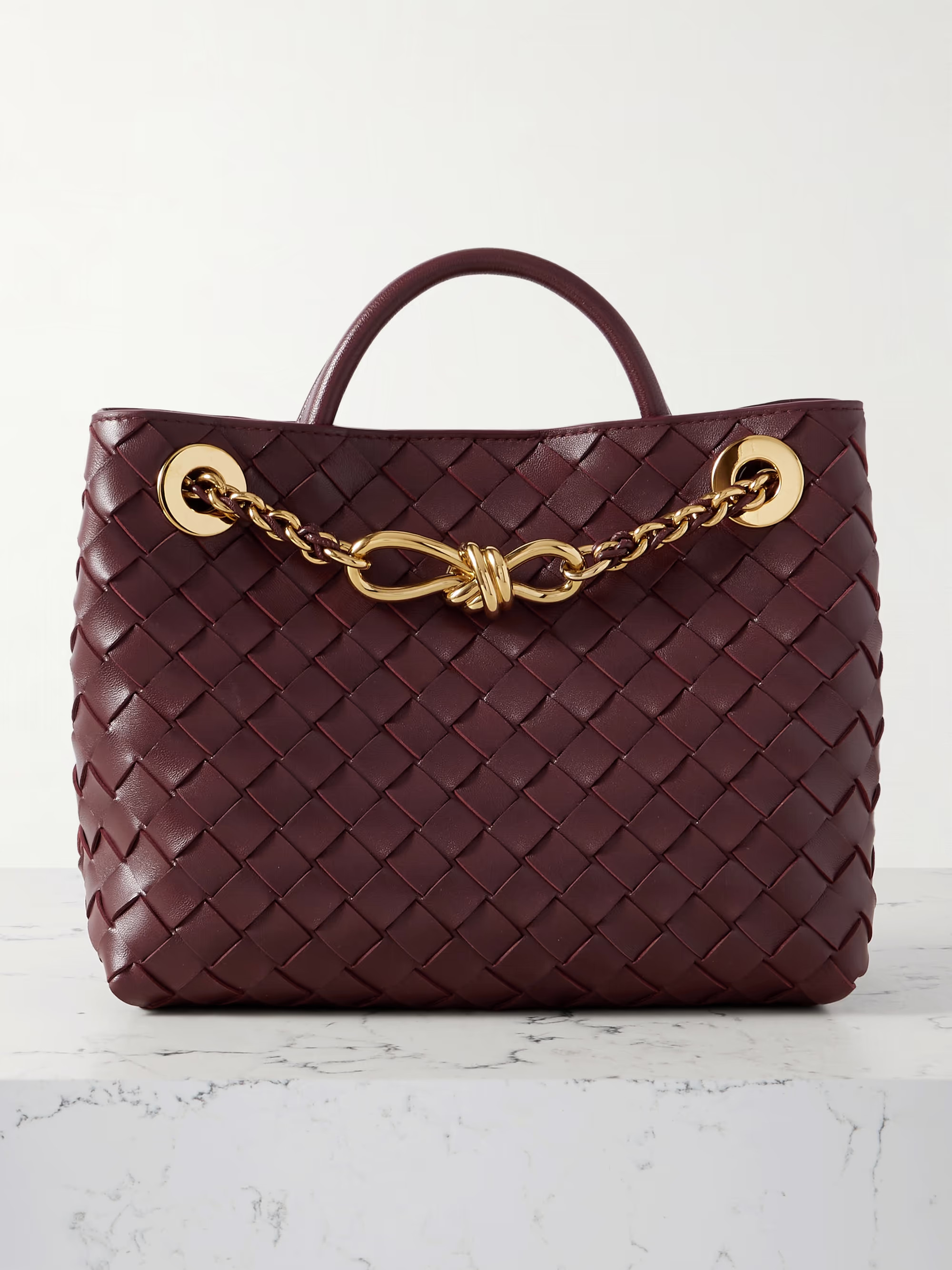 With its name translating to 'Let's go' in Italian, Bottega Veneta's 'Andiamo' bag is quite obvio... | NET-A-PORTER (US)
