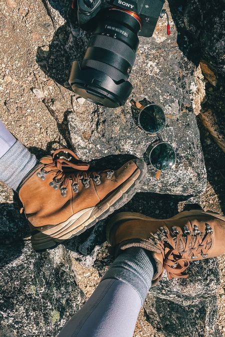 Tried and true hiking essentials: Danner hiking boots, Abercrombie YPB leggings FITS hiking socks, sunglasses and Sony mirrorless camera

#LTKtravel #LTKunder100 #LTKfit