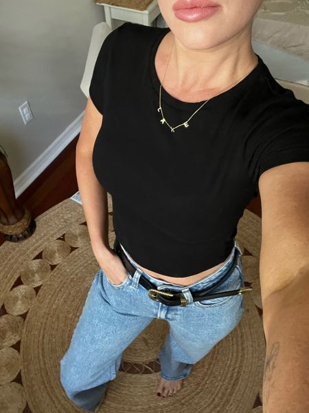 The perfect black cropped tee. This one has not faded in the wash! Wearing a size small for a snug fit. Size up for a looser fit. 25 long curve love in the jeans 

#LTKstyletip #LTKSeasonal #LTKfindsunder50