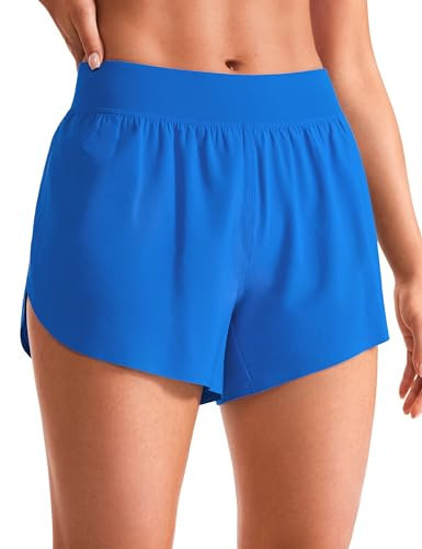 CRZ YOGA Mid Waisted Dolphin Athletic Shorts for Women 4" Lightweight High Split for Gym Workout with Liner Quick Dry Sparkle Blue Large | Amazon (US)