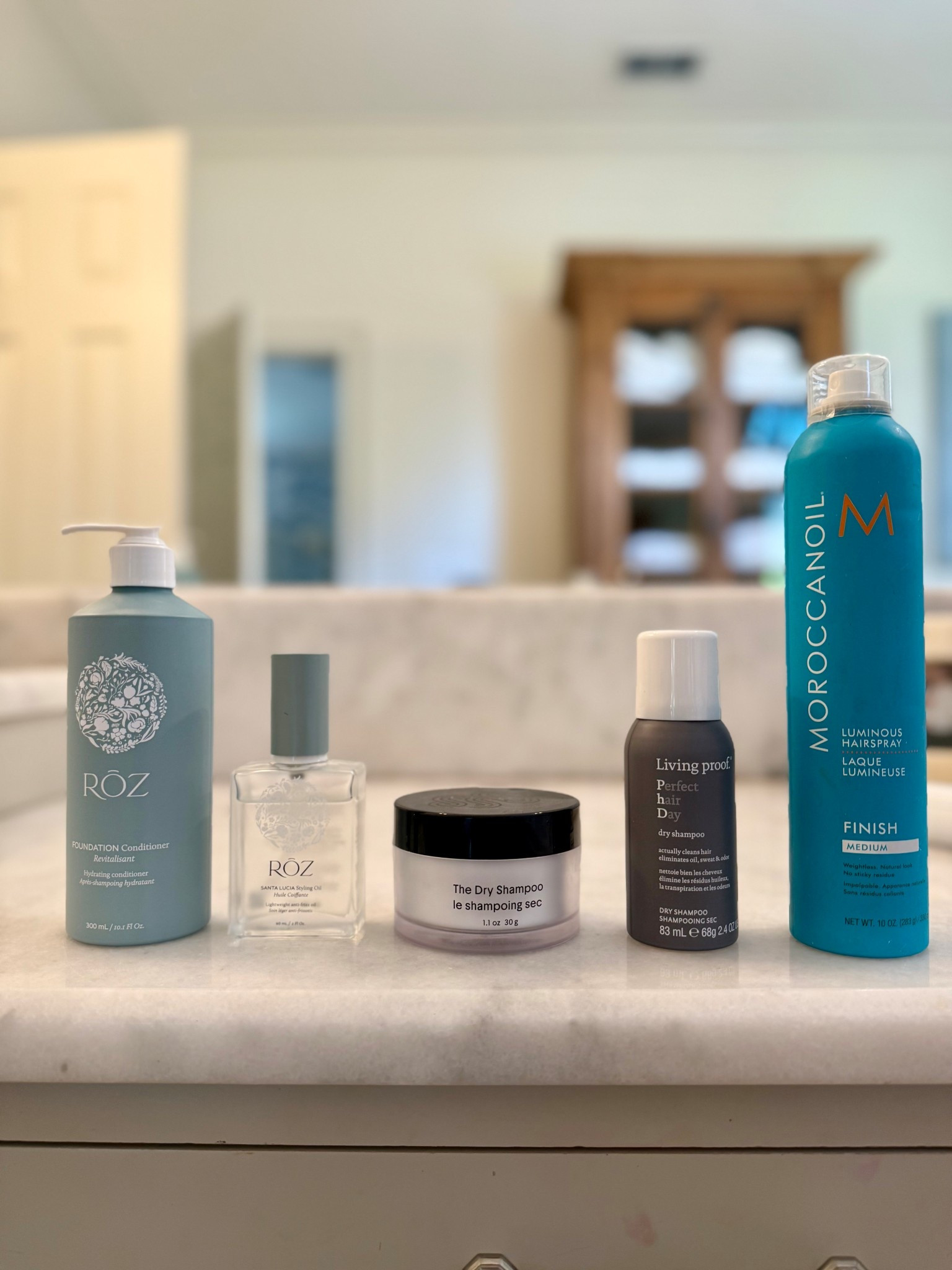My go-to products for styling and caring for my hair!

When I feel like my hair needs a little pick-me-up, I grab the Olaplex No. 8 Mask. I don’t use it super often—maybe once a month or every other month—but every time I do, my hair is instantly softer and shinier.

Roz Hair Oil - I use this on damp hair before I blow-dry, and then a little after to smooth and keep frizz down.

Dry Shampoo - Crown Affair or Living Proof → both are great and don’t leave that weird chalky buildup.

Hairspray - Living Proof or Moroccanoil → keeps things in place without feeling crunchy for the rare occasion I need it!

#LTKSeasonal #LTKBeauty