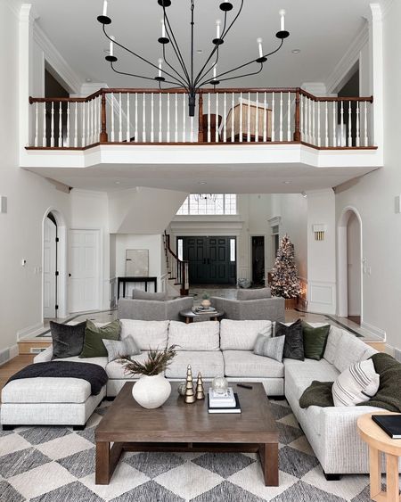 Great Room, neutral decor. Checkered rug. World market, sectional, neutral decor, large coffee table.