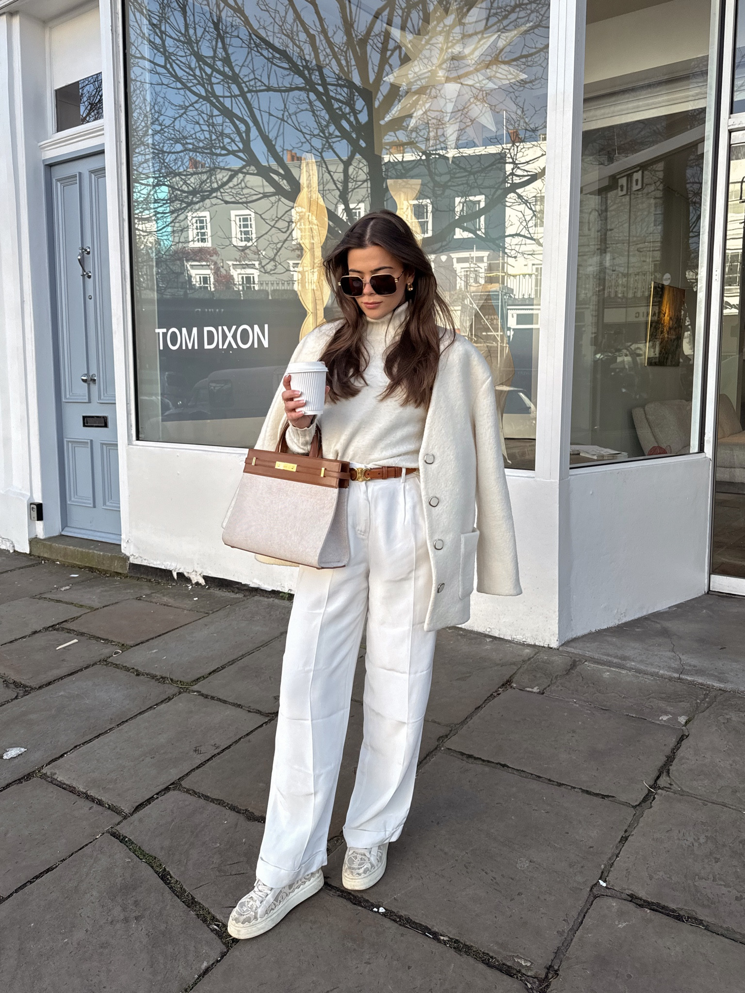 White trousers, turtleneck knit top, wool jacket, brown leather belt, white pattern trainers, good rimmed sunglasses, straw leather tote bag

#LTKSeasonal #LTKeurope #LTKstyletip