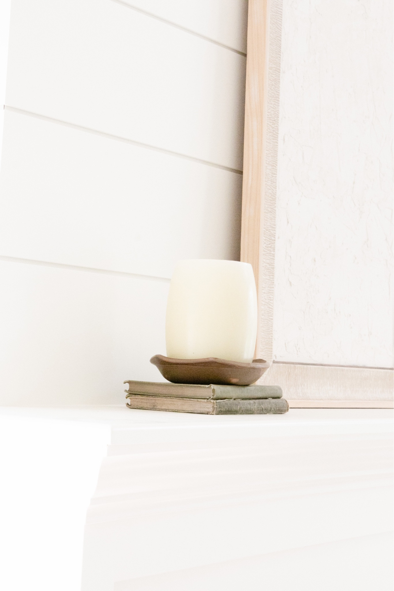 FARMHOUSE VINTAGE VIGNETTE 
.
Vintage books and pottery adds the right amount of beauty to your mantle! 
.
And minimalist art as well 🤍

#LTKFind #LTKstyletip #LTKhome