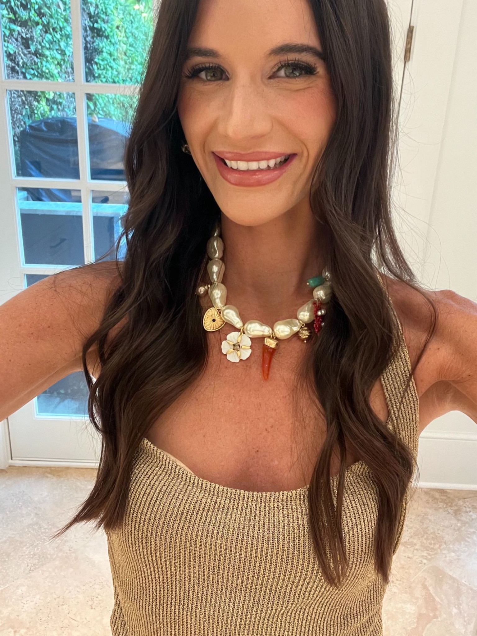 Charm necklace | pearl | statement necklace | Zara | gold | metallic | date night | summer outfit | free people | Anthropologie | night out | halter | Zara | chunky necklace | vacation outfit | resort wear | travel 

#LTKTravel #LTKParties #LTKBeauty