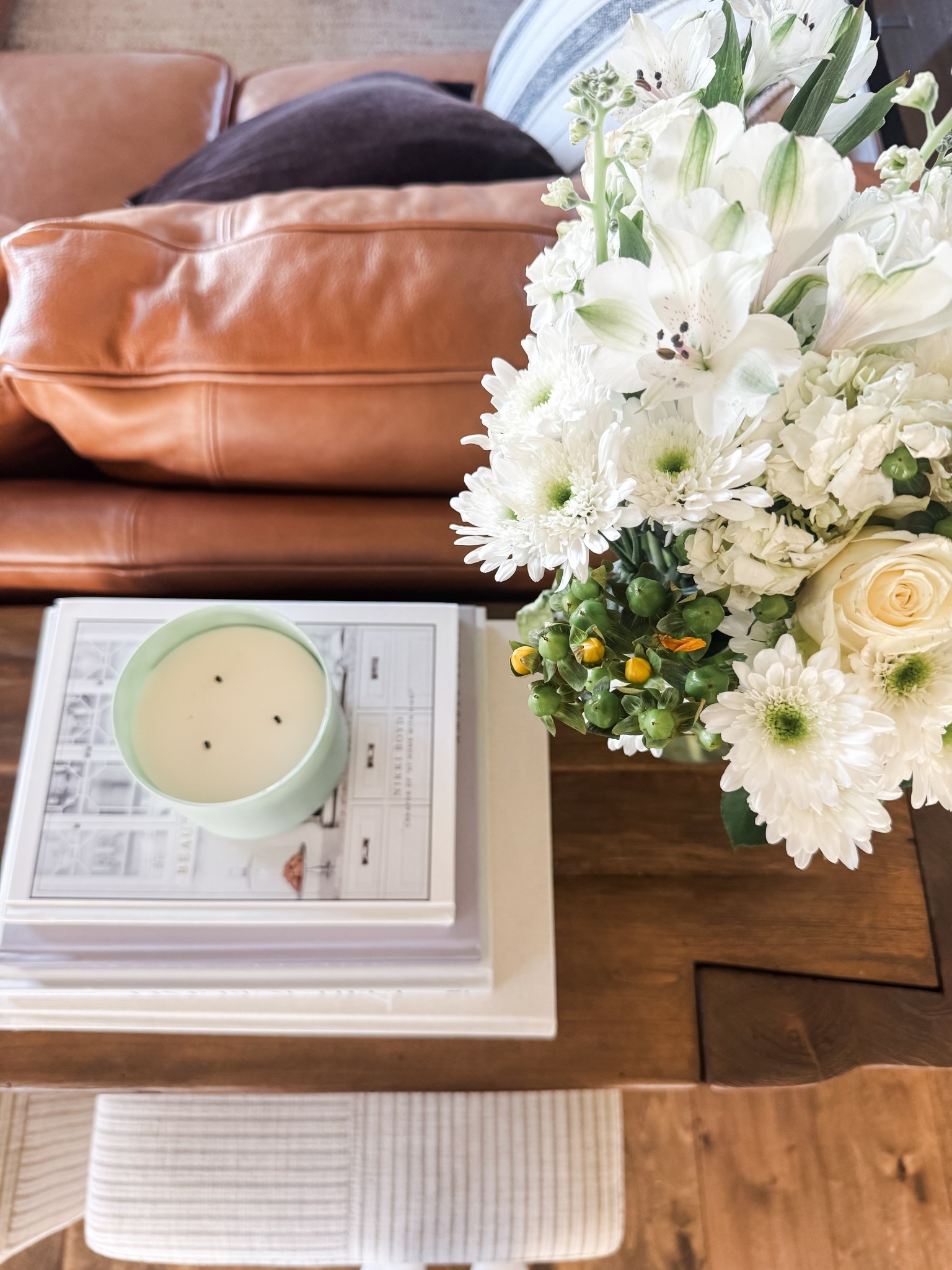 Fresh florals, stacked coffee table books, and a favorite candle — the simple touches that make a house feel like home. Linked my go-to coffee table books, a similar candle, and a few faux floral options to recreate this look! 

#LTKSeasonal #LTKHome