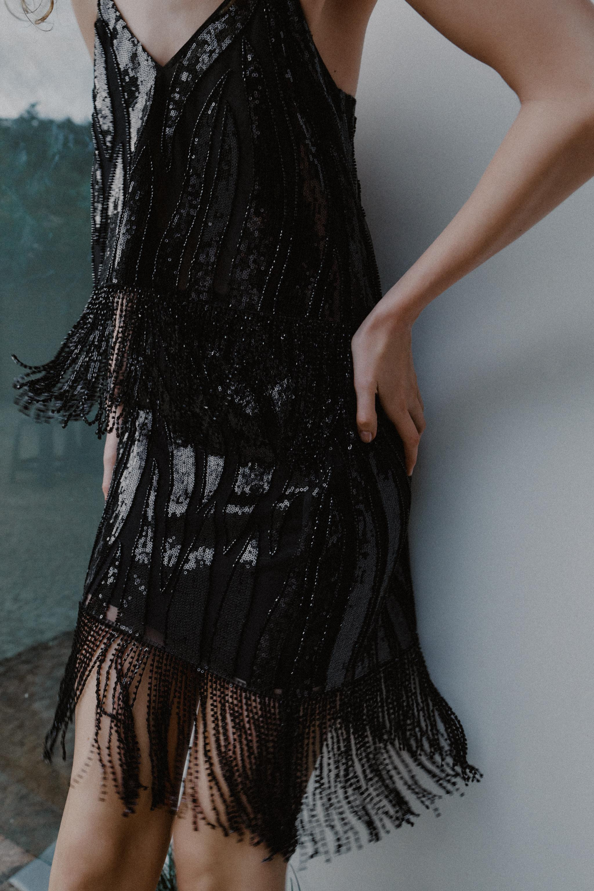 DescriptionCompositionMeasurementsShort sequin skirt. Featuring a fringed hem with beaded detaili... | Zara UK