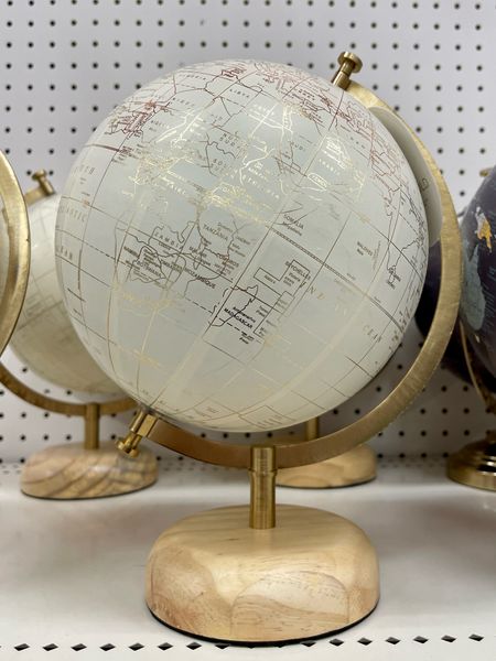 Cream + gold modern world globe with wooden base. 💫 Perfect for a home office, library, or study area! 

#LTKhome #LTKfindsunder50
