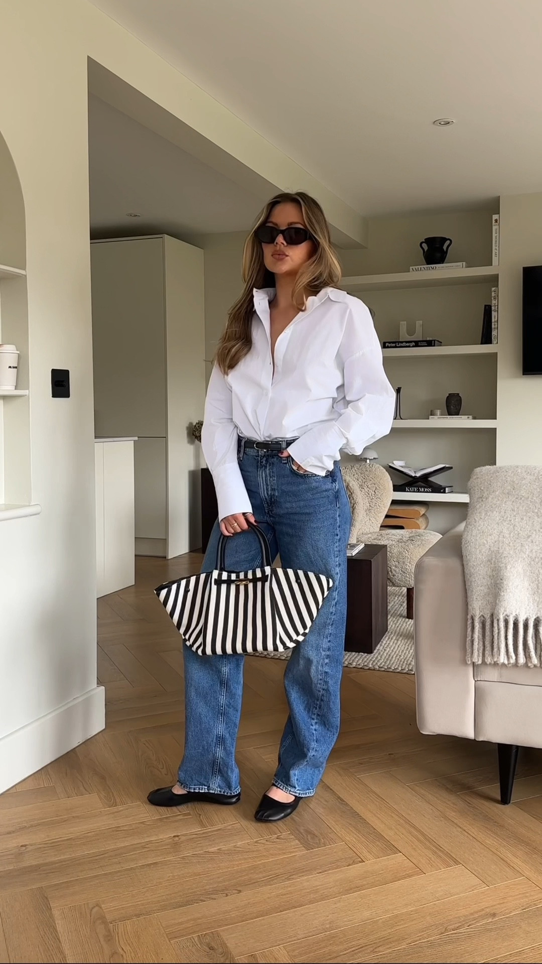 White shirt, blue jeans, waistbelt, monochrome bag, ballet flats, transitional outfit, transitional wardrobe staples, spring capsule wardrobe, classic spring outfits. chic outfit. 

#LTKfindsunder50 #LTKstyletip #LTKfindsunder100