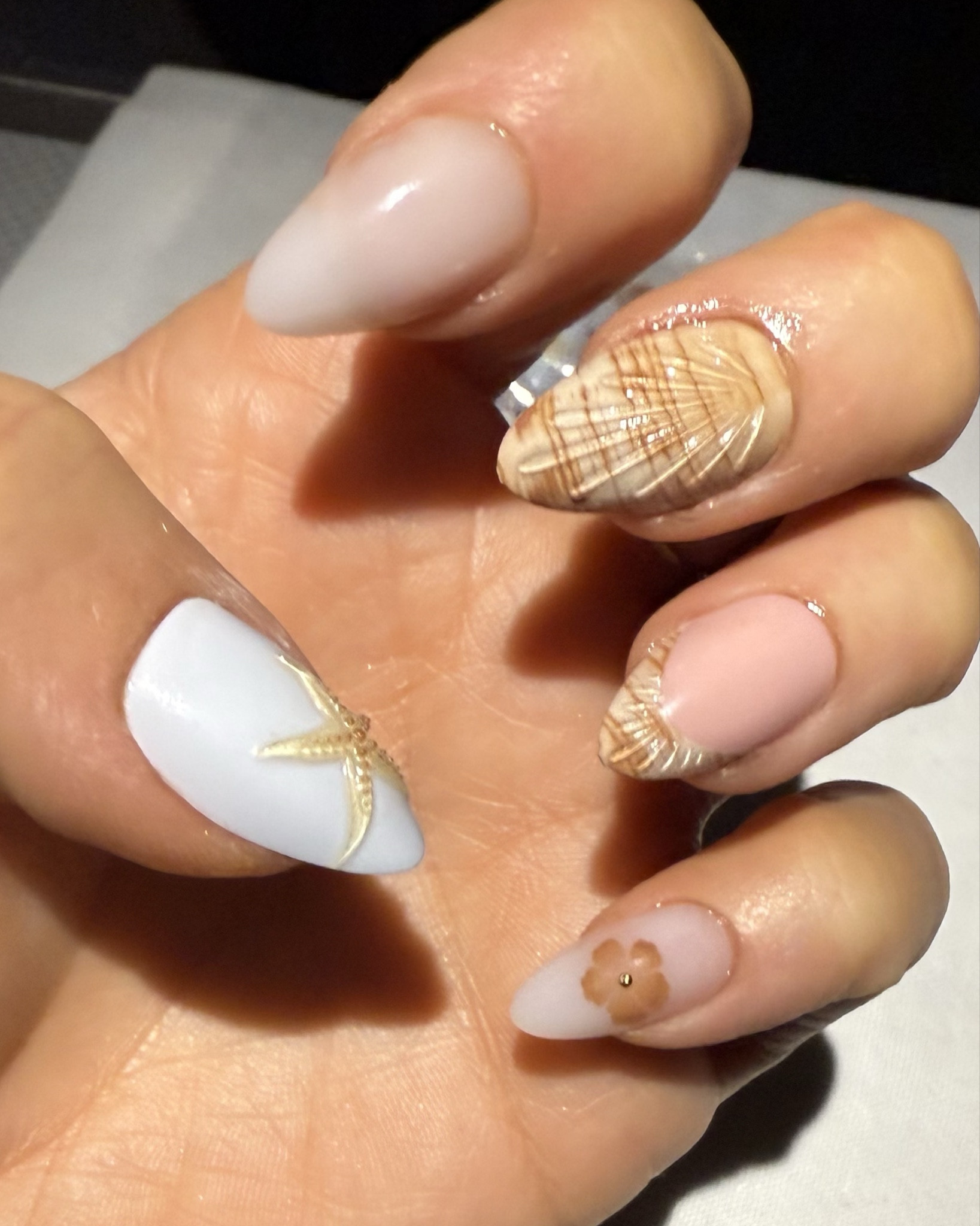 Same nails just natural light makes look more white but there is a hint of blue and these shell press ons are too cute for a beach trip 

#LTKStyleTip #LTKBeauty #LTKSeasonal