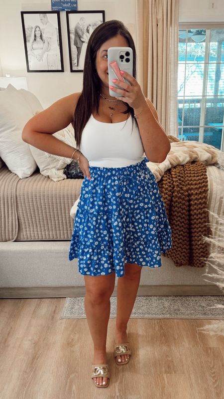 Spring blue floral mini skirt that fits my petite frame perfect! Paired it with an Amazon white crop top and tan slides. Love this look for a summer date night or throw on a jean jacket for a more casual look. Amazon mini skirt.

#LTKfindsunder100 #LTKfindsunder50 #LTKSeasonal