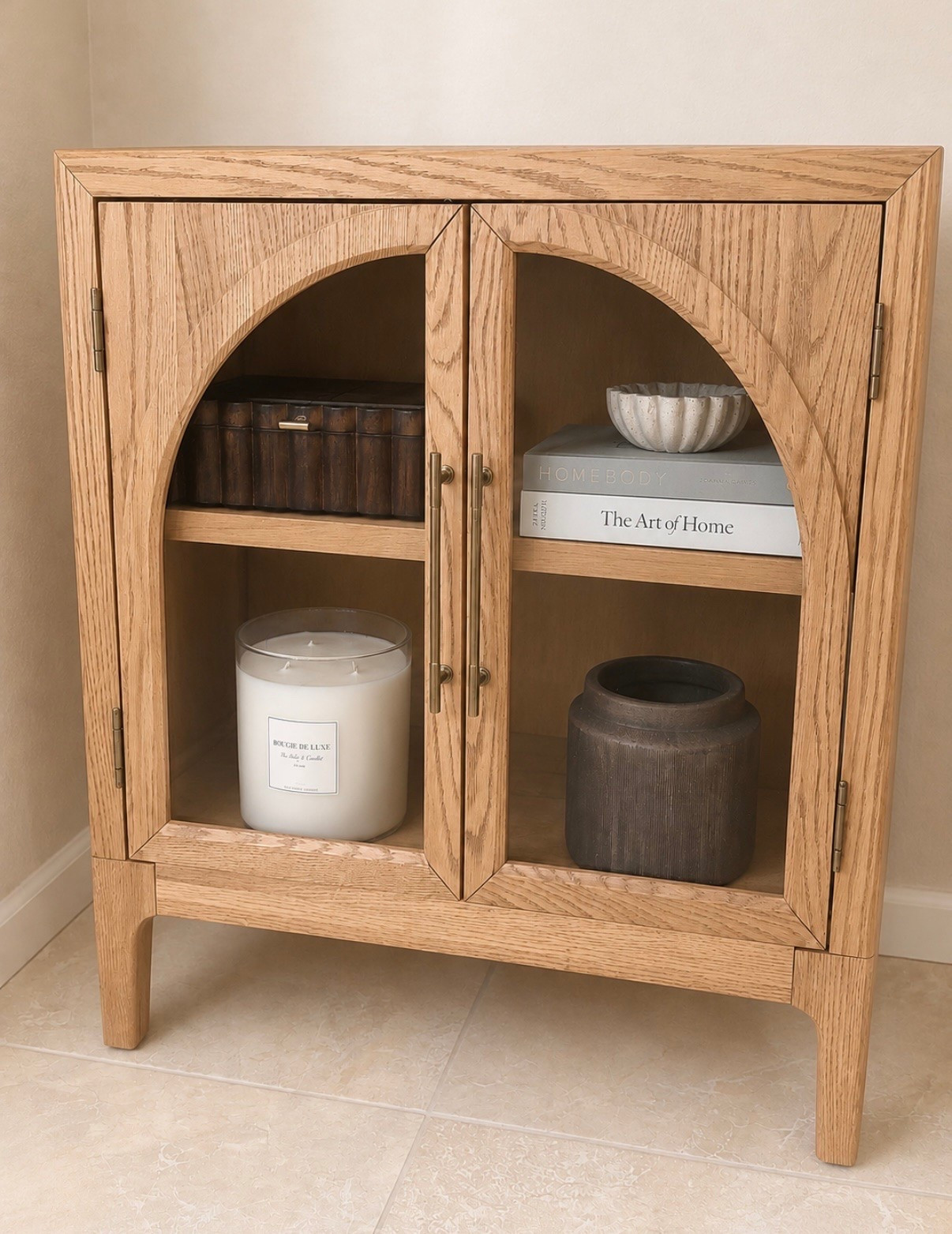✨ my new cabinet finally arrived and I’m honestly SO impressed with the quality 🤎

I grabbed it on clearance and it has such an elevated warm neutral designer look in person — the arched glass detail and rich wood grain are even prettier than I expected 🙌

✔ crafted with solid oak + oak veneers
✔ beautiful wire-brushed wood grain texture
✔ kiln-dried wood for added durability
✔ gorgeous hidden storage
✔ works as a cabinet, entryway piece, coffee bar, or media console

there are also so many matching pieces in the collection and it comes in 3 color options 👏

I also found affordable look-alikes for a fraction of the price if you love this style but want a lower price point ✨

details linked here 🤍

#LTKdayinmylife