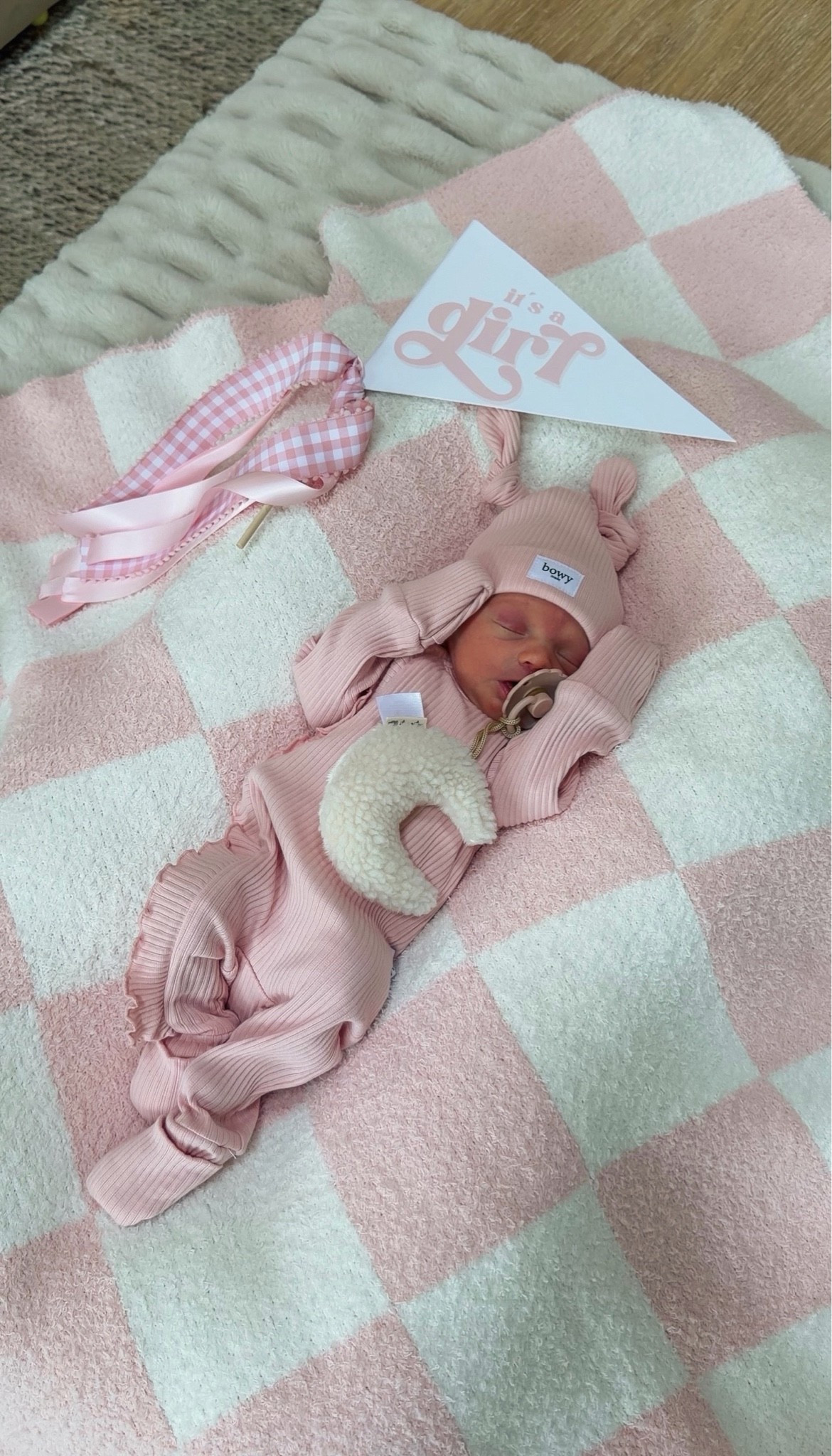 The outfit and hat are from Bowy Made (can’t link!) and she’s wearing the newborn size!