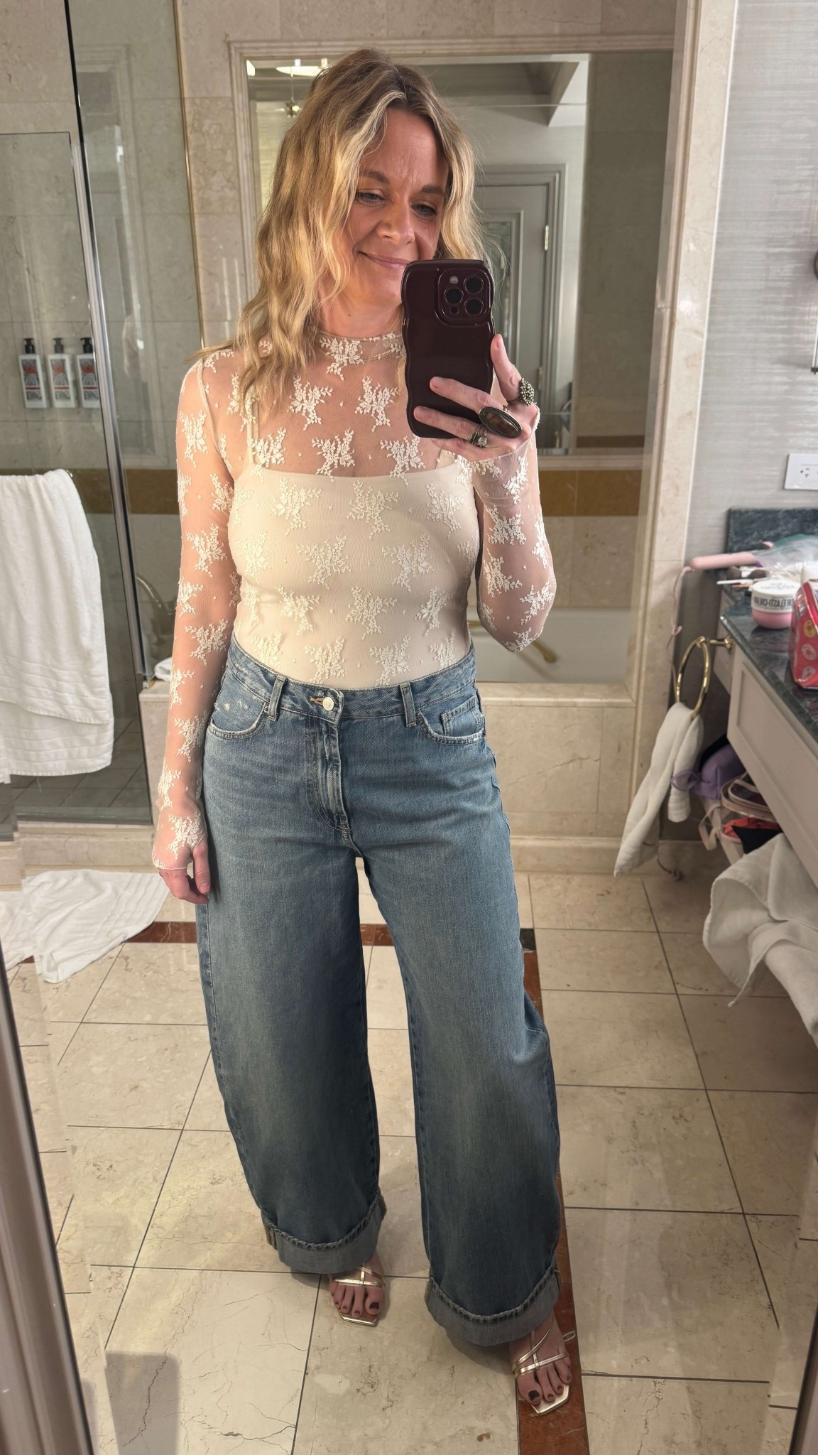 Shop My Vegas Night 2 Look🌟

Night two was the main event—dinner reservations followed by the Backstreet Boys concert at The Sphere. A lot of people wear all white to BSB Sphere concerts, but I’m just not a theme girl (much to my girlfriends’ dismay). So I did “white” my way.

I rented this ivory lace bodysuit from Nuuly and paired it with wide-leg jeans I’d recently picked up from Zara. Gold metallic sandals, big gold hoop earrings, and a few statement rings finished the look. I threw my faux leather jacket over my shoulders for photos, but ended up leaving it behind since the weather was nice and I didn’t want to carry it all night.

#LTKdayinmylife #LTKootd #LTKgrwm