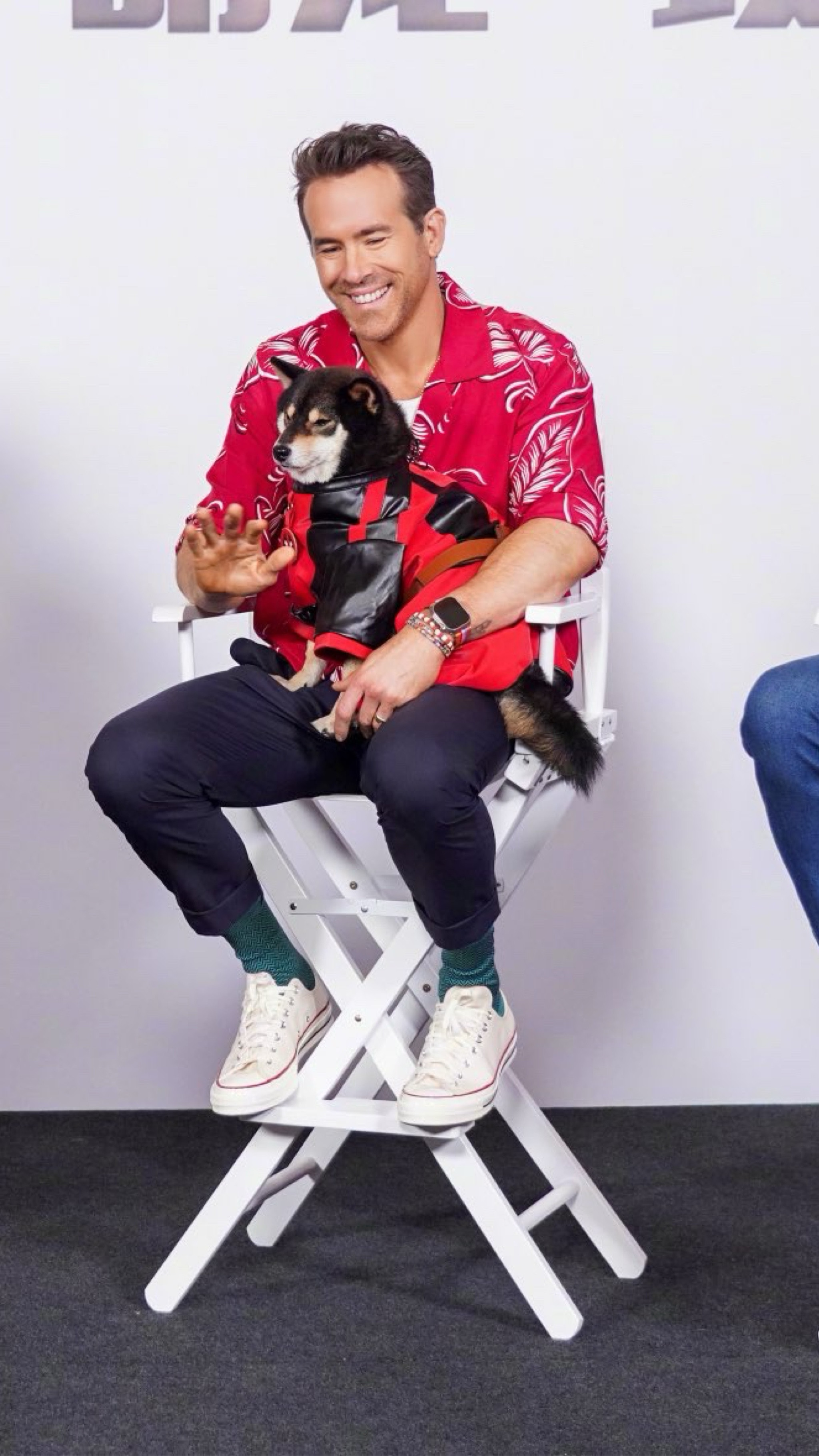 Ryan Reynolds in Shanghai promoting Deadpool & Wolverine a begonia camp-collar shirt, drawstring pleated trousers, and converse low tops