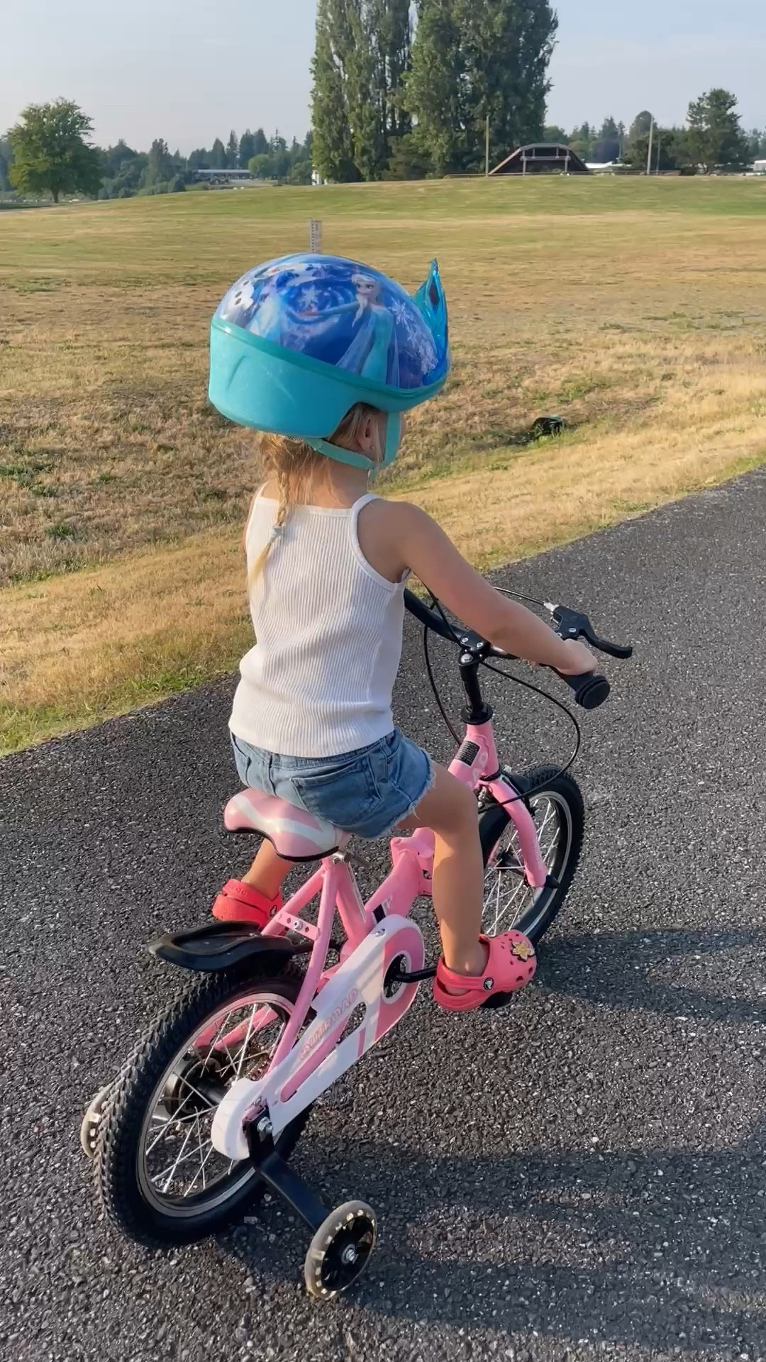 Toddler bike and Frozen helmet. This is my 3 year olds first bike and she does so well on it. It folds up for easy transportation and the training wheels light up. 

#LTKFamily #LTKKids #LTKFindsUnder100