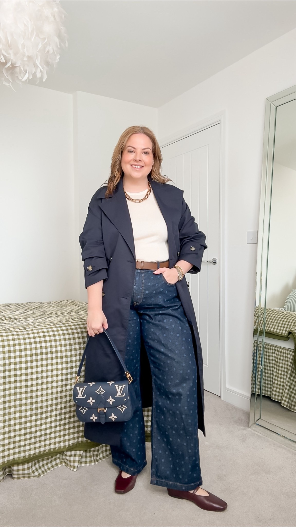 Navy spring out, navy trench coat, polka dot jeans 

#LTKspring #LTKjeans #LTKmidsize