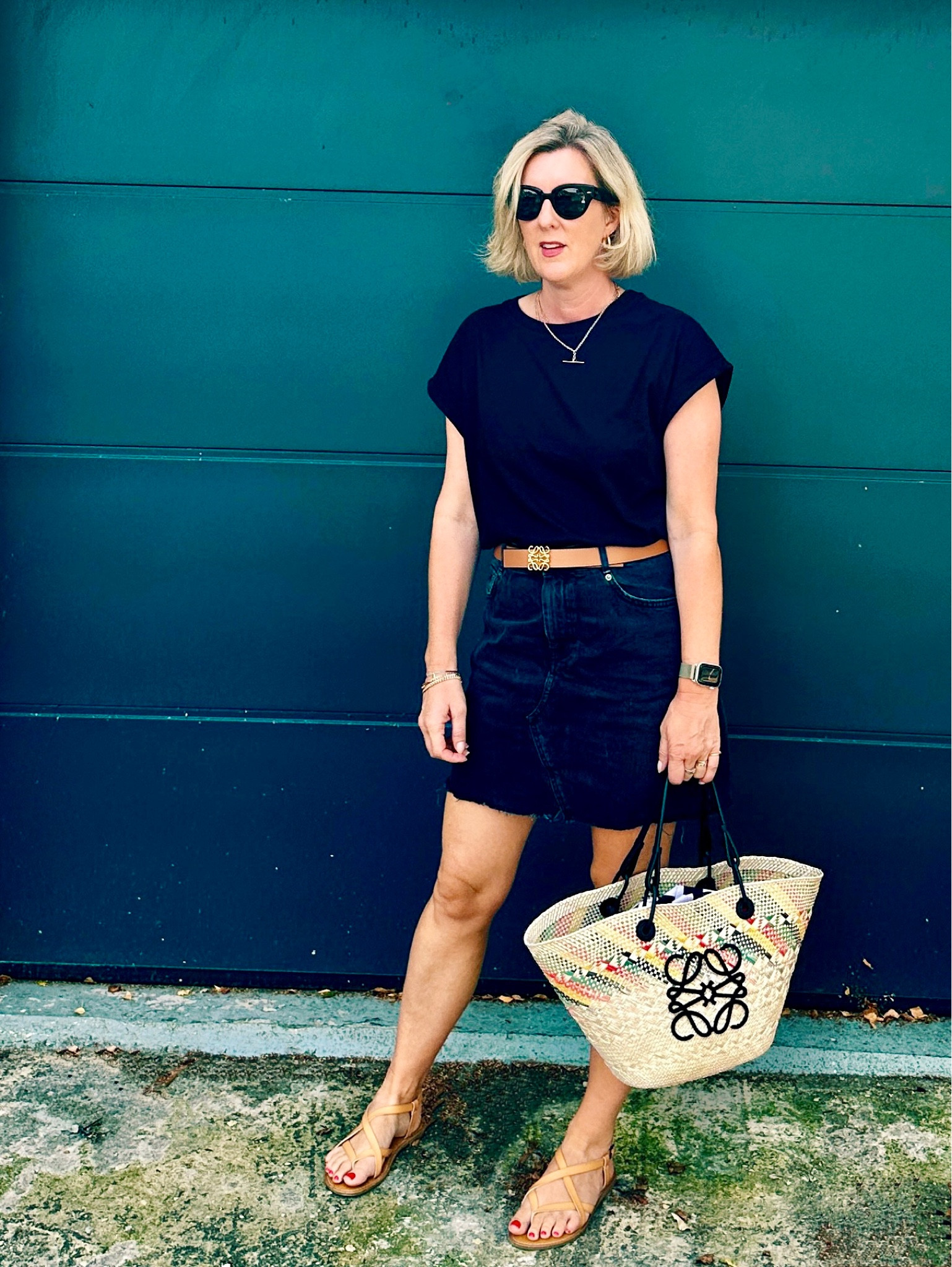All black forSeptember heatwave. Black t shirt, black denim mini skirt. Loewe bag and belt 

#LTKeurope #LTKover40 #LTKSeasonal