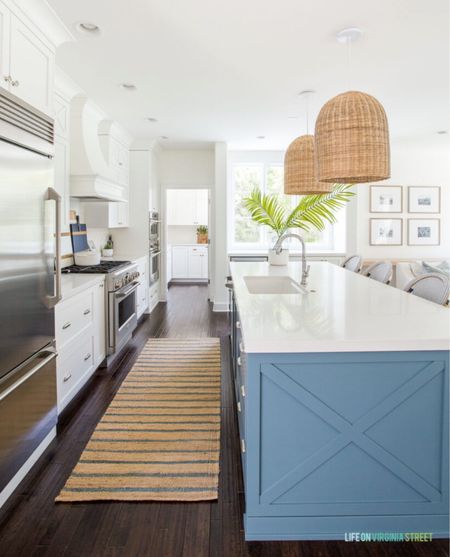 Our coastal kitchen decorated with a neutral runner, blue and white wicker barstools, woven rattan island pendants, a paint dipped vase with oak branches, a polished silver faucet and a terracotta bowl with faux florals. I’ve also linked my favorite cheese boards and the wood frames on our gallery wall in the living room! 

coastal kitchen, bar stools, neutral decor, kitchen runner, kitchen island lighting, kitchen hardware, pendant lights, kitchen chairs, kitchen bar stools, amazon home, kitchen counters, amazon kitchen, kitchen accessories, cutting boards, serena and lily kitchen, kitchen counters, island bar stools, amazon finds, amazon home, pottery barn kitchen, serena & lily inspired, pottery barn, pb inspired, coastal decorating, coastal design, coastal inspiration  

#LTKunder100 #LTKunder50

#LTKhome #LTKstyletip #LTKsalealert