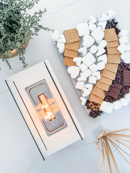 This little indoor fire pit is such a fun date night idea 👏🏼 make your own heart shaped smores! Date night, fire pit, indoor fire pit, solo stove, smores, date idea, chocolate, hersheys, graham crackers, marshmallows, cookie cutter, marble serving tray, gold bowl, hobnail glasses, Modern home decor, traditional home decor, budget friendly home decor, Interior design, look for less, designer inspired, Amazon, Amazon home, Amazon must haves, Amazon finds, amazon favorites, Amazon home decor

#LTKFamily #LTKParties #LTKHome
