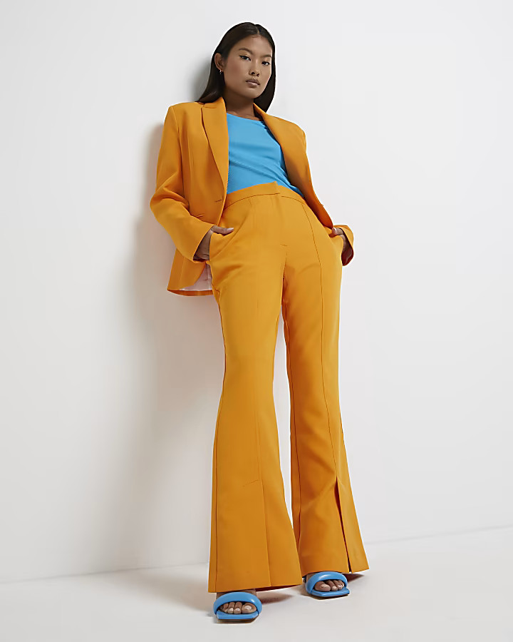 Orange split hem flared trousers | River Island (UK & IE)