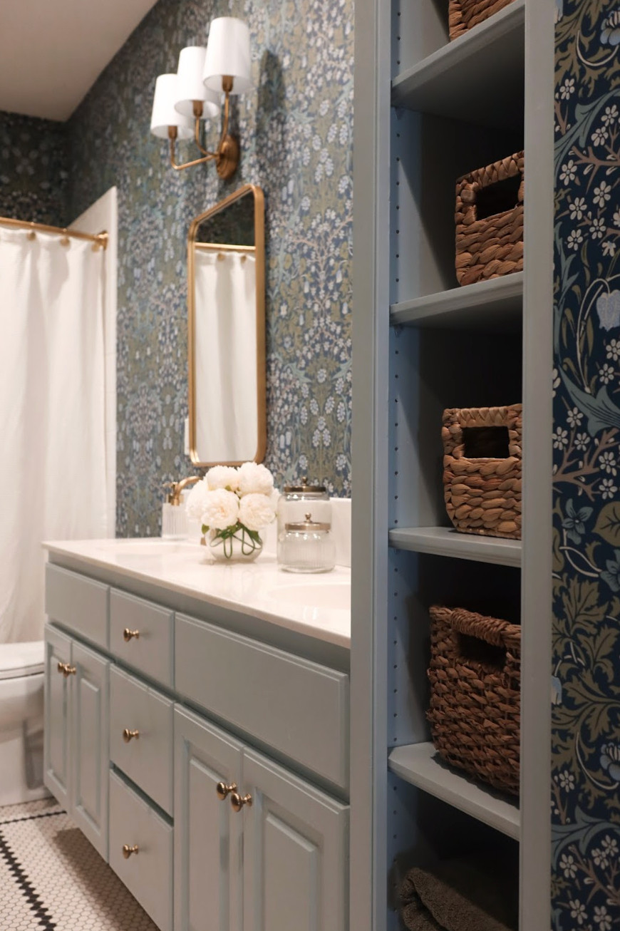 This traditional blue bathroom renovation is proof that timeless design can completely refresh a space.✨ What was once an outdated green bathroom is now a serene retreat featuring soft blue tones, crisp white accents, and elegant fixtures. We kept the design grounded in classic style to create a look that feels both elevated and practical — clean, calming, and cohesive with the rest of the home. The result is a peaceful, family-friendly bathroom that feels fresh and timeless without chasing trends.💙 

 #traditionalbathroom #timelessdesign #nashvilleinteriors #LTKHome #LTKFamily
