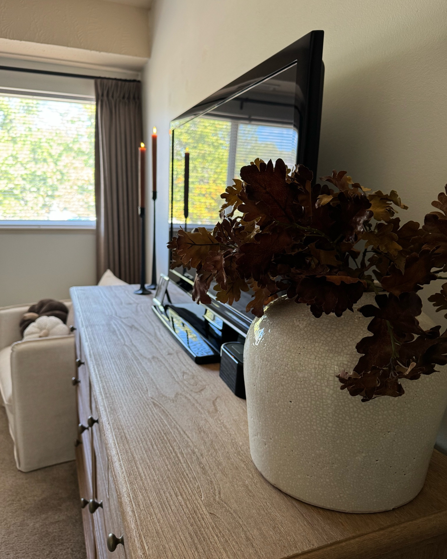 Sausalito dresser, oak stems, white vase, arhaus, pottery barn, coffee table books, cream chair, brown knit blanket, gingham bedding, pumpkin pillow,

#LTKSeasonal #LTKSaleAlert #LTKHome