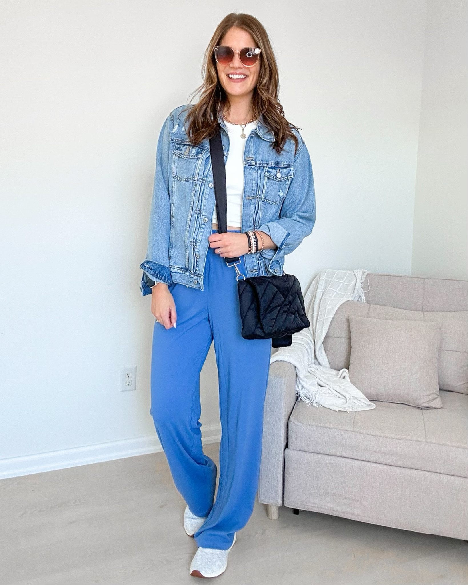 Jean jacket size L. White cropped double lined tank in L. Tall track pants size L 36” inseam. New Balance sneakers go up a half size. Black puffer crossbody bag. Retro sunglasses. Bracelet stack. No show socks. 

Ootd, casual outfit, spring outfit, athleisure, loungewear 

#LTKshoecrush #LTKstyletip #LTKfindsunder50