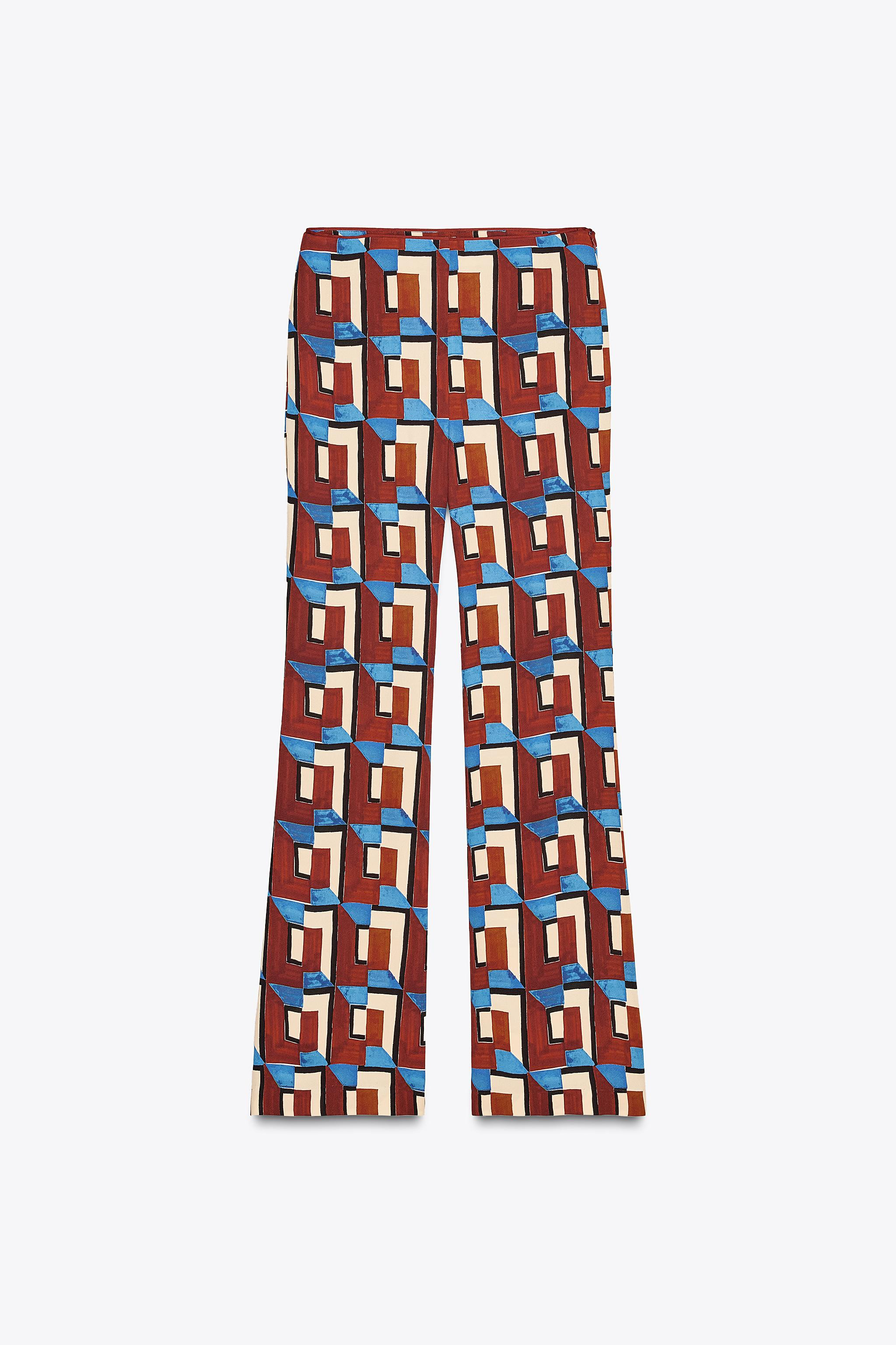 ZARA WOMAN COLLECTIONMid-rise pants made of viscose yarn. Side seam pockets. Flared hem. Side zip... | Zara US