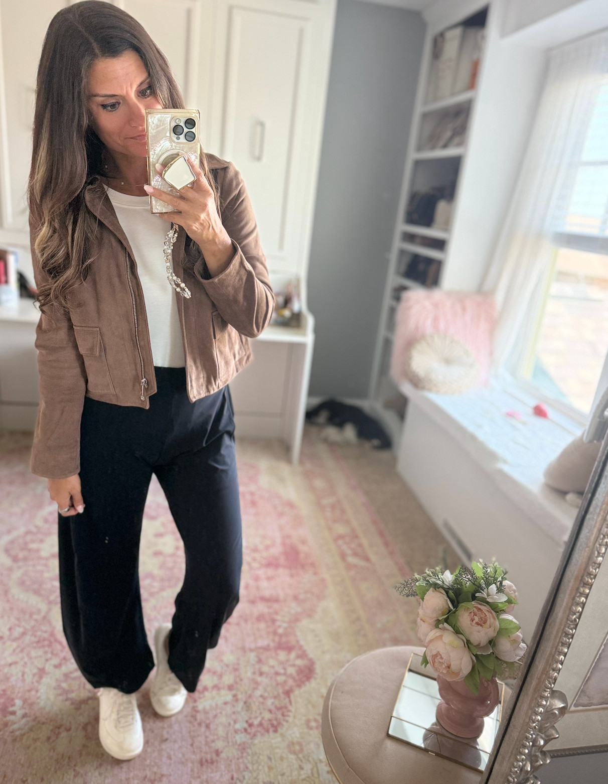 Casual fall outfit with a suede jacket and black pants with sneakers 

 