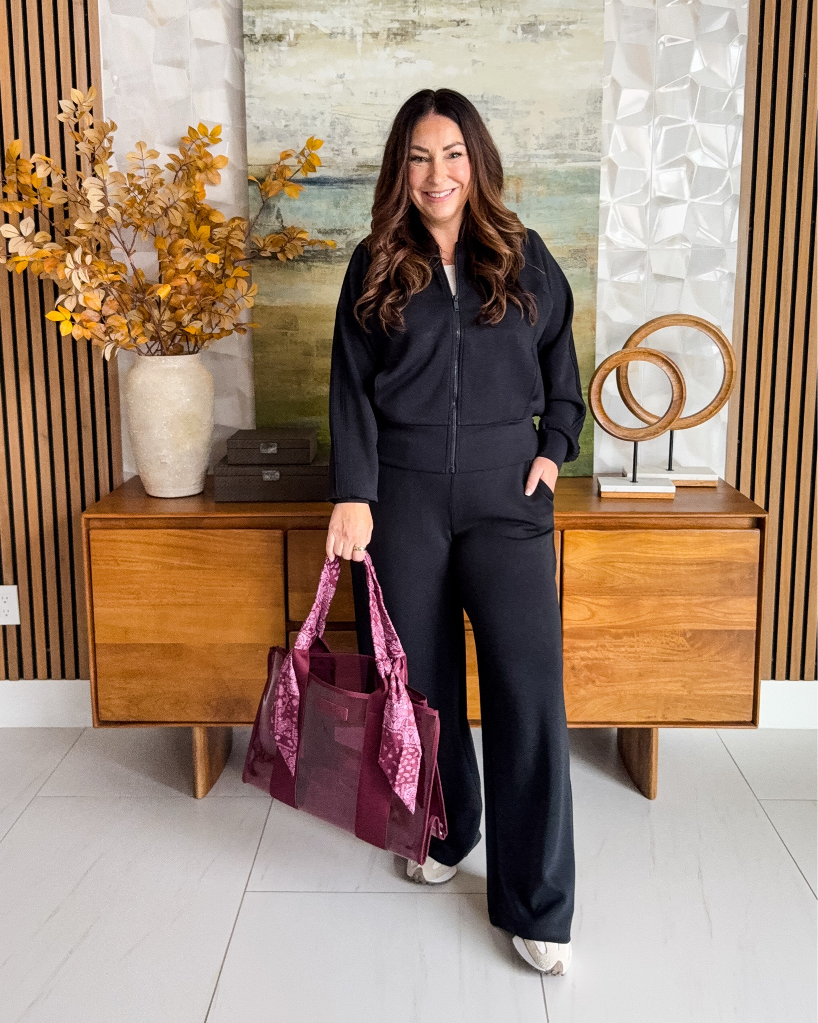 The Spanx AirEssentials fabric gets me every time 🙌 This black track set is so comfy but still looks completely pulled together for travel, errands or everyday. | Wearing Jacket tts, L ; Pants tts, L Regular

#LTKSeasonal #LTKOver40 #LTKMidsize