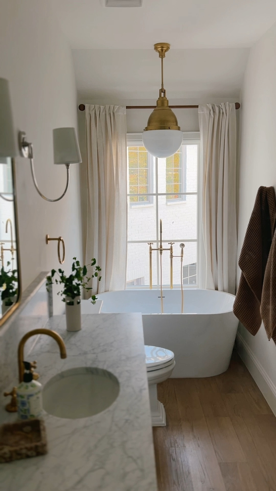The guesthouse bathroom is one of my favorite spots. I was working with the tiniest footprint which allowed me to splurge on some special features and really save in others. The drapes are Amazon, the towels and rug are Target and the lighting is jewelry for sure. 

Bathroom
Bathroom design
Interior design
Home decor
Unlacquered brass
Target home
