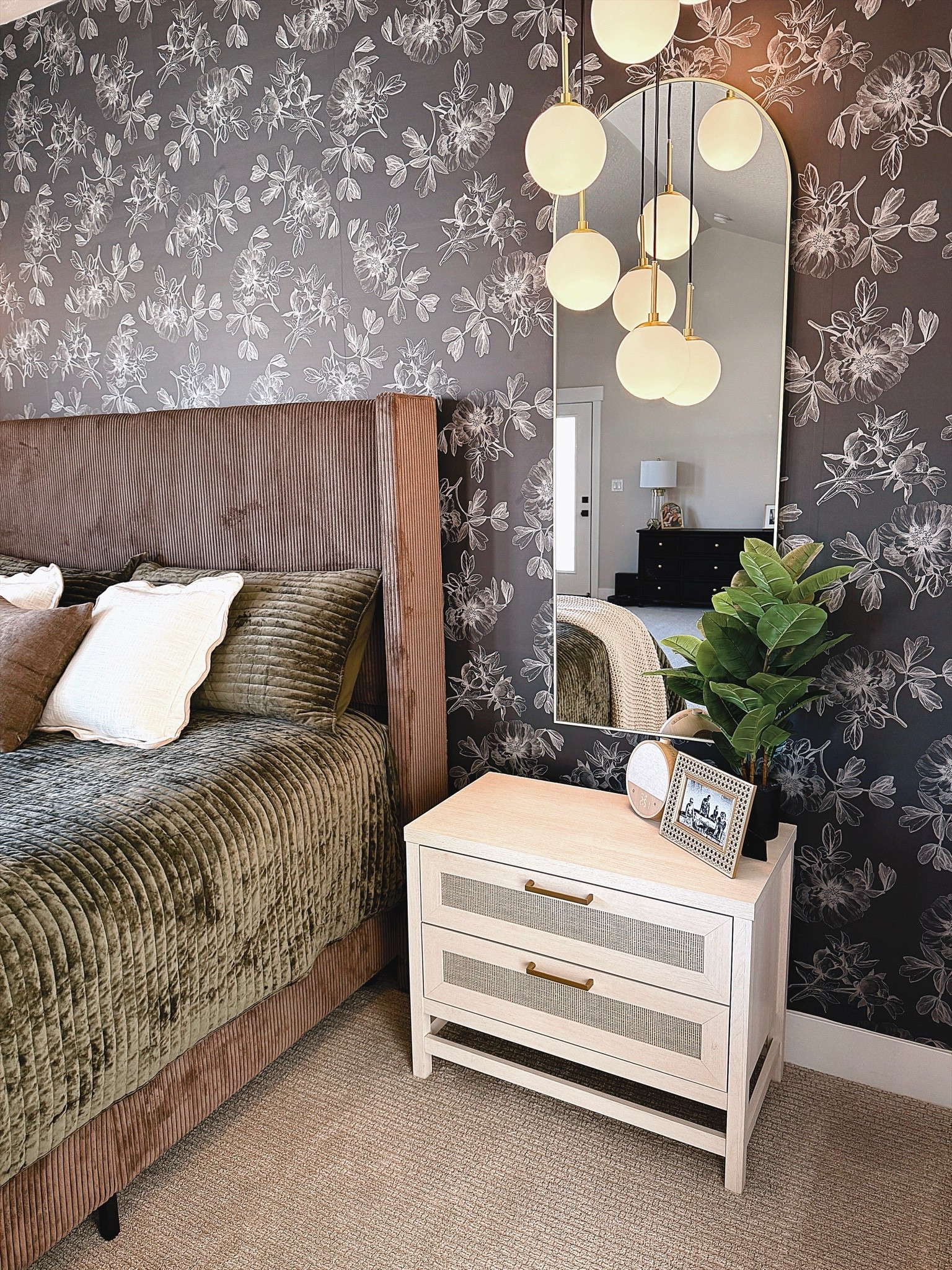 One of my favorite corners in our bedroom. The moody floral wallpaper, warm wood bed, layered textures, and soft globe lighting create the perfect mix of cozy and elevated. If you love rich, dramatic spaces that still feel inviting, this look is for you. Sharing all the details that helped bring this room together. 🤎 #LTKHome #BedroomInspo #MoodyDecor #BedroomDesign #HomeDecorIdeas #ModernTraditionalHome

#LTKSeasonal #LTKHome