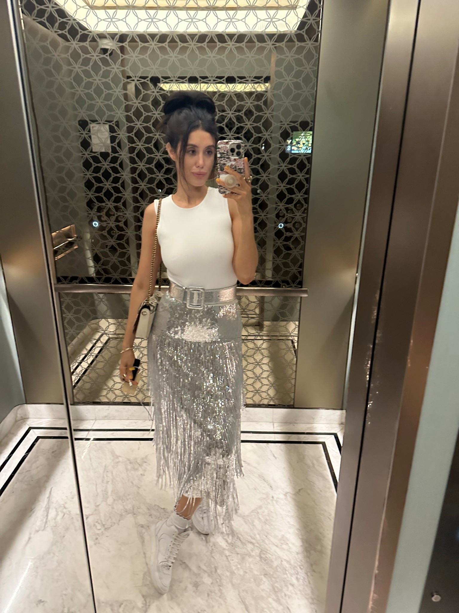 Silver sequin fringe skirt

Fringe skirt outfit, fringe sequin skirt, metallic skirt, midi skirt, white high neck bodysuit, white take top, white bodysuit, metallic belt, silver belt, channel sneakers, high bun outfit, messy bun outfit, travel outfit

#LTKBeauty #LTKTravel #LTKootd